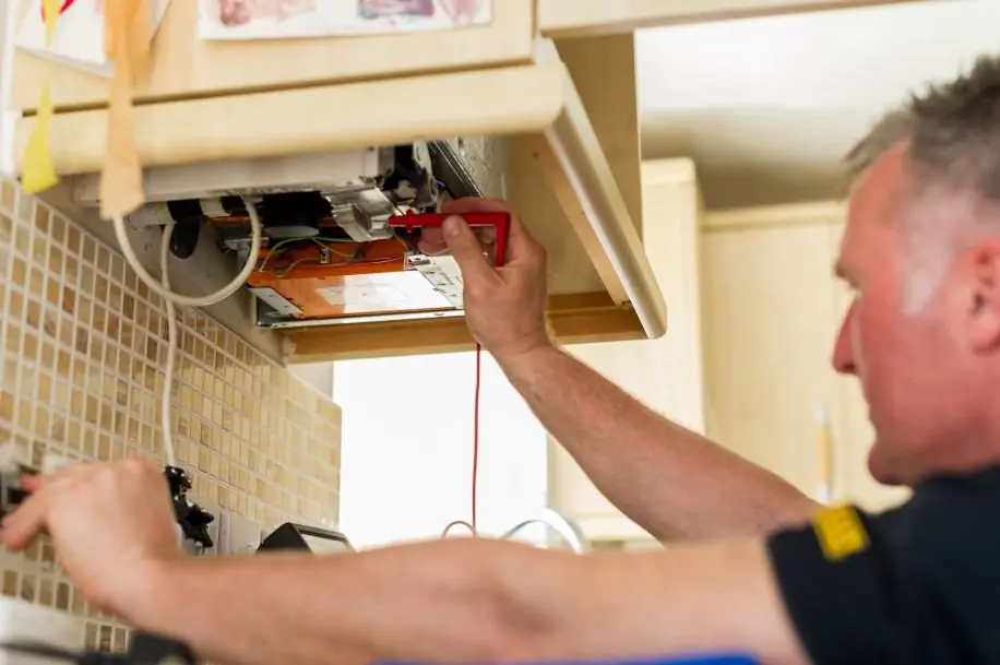 Man fitting boiler