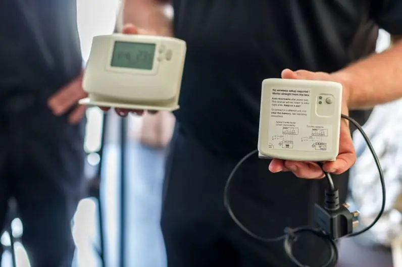 People holding up controls